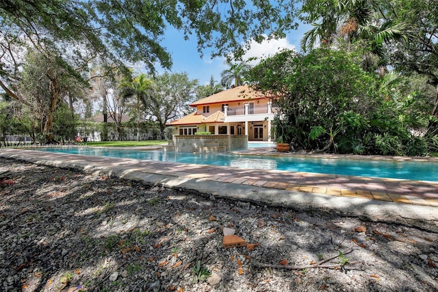 view of swimming pool featuring a patio area