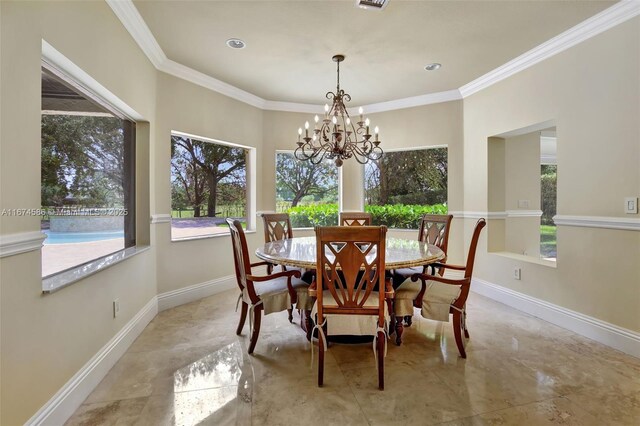 dining area with an inviting chandelier and crown molding