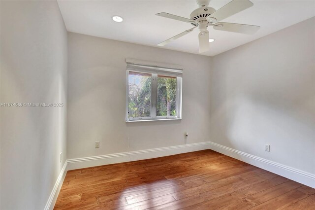 unfurnished room with ceiling fan and wood-type flooring