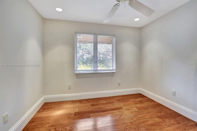 empty room with ceiling fan and light wood-type flooring