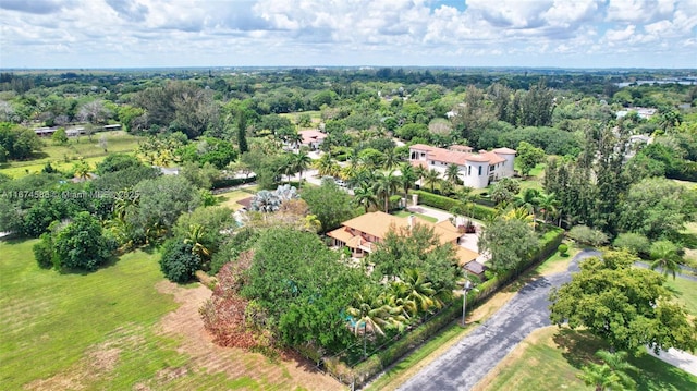 aerial view featuring a view of trees