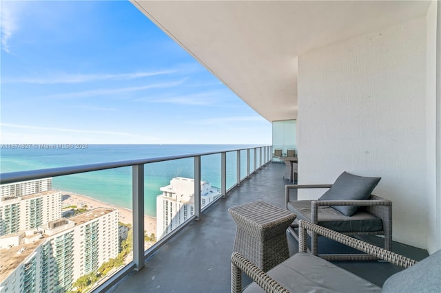 balcony with a beach view and a water view