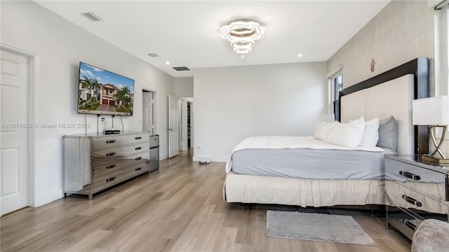 bedroom with light wood-type flooring