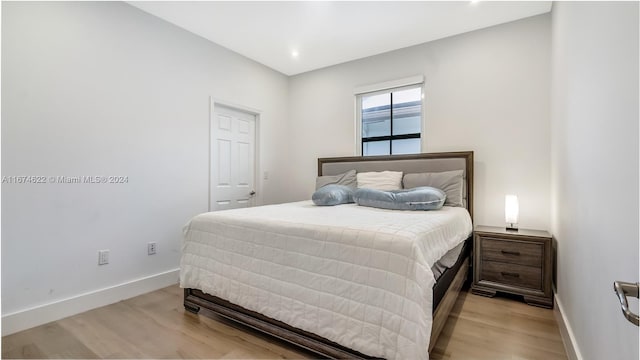 bedroom with light wood-type flooring