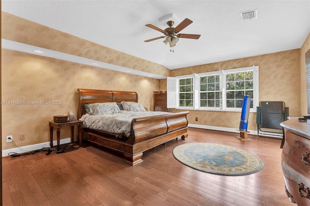 bedroom with wood-type flooring and ceiling fan