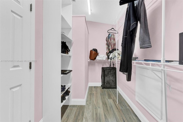 walk in closet featuring light wood-type flooring