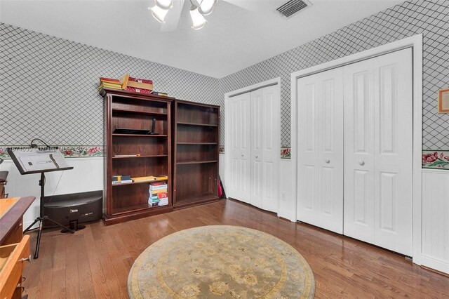 interior space featuring hardwood / wood-style floors and a notable chandelier