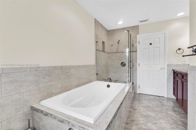 bathroom with plus walk in shower and vanity