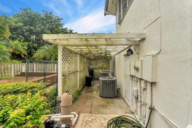 view of patio / terrace featuring a pergola and central air condition unit