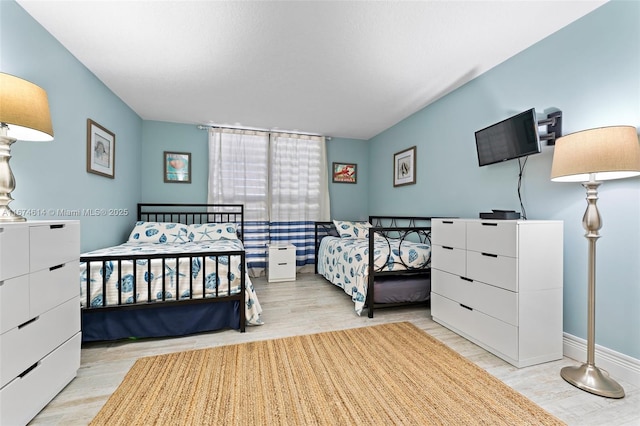 bedroom with light hardwood / wood-style floors