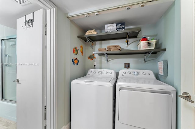 laundry room featuring independent washer and dryer