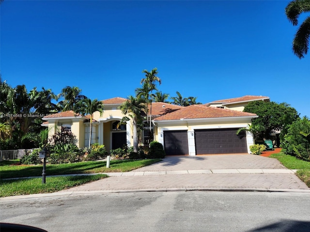 mediterranean / spanish-style home featuring a garage