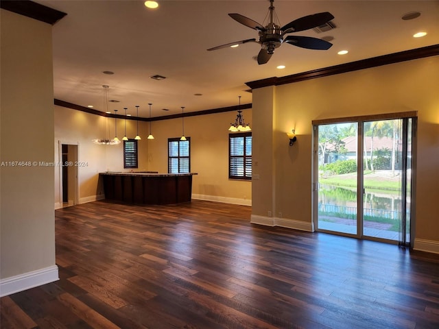 unfurnished living room with ornamental molding, ceiling fan, and dark hardwood / wood-style floors