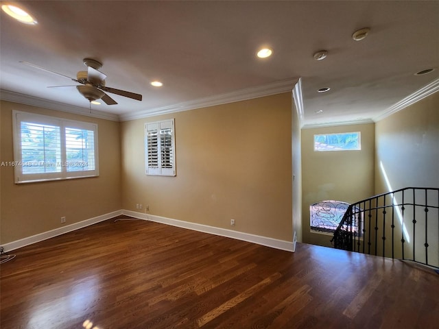 spare room with dark hardwood / wood-style floors, crown molding, and ceiling fan