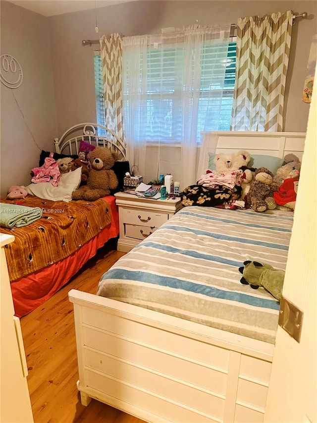 bedroom featuring hardwood / wood-style flooring