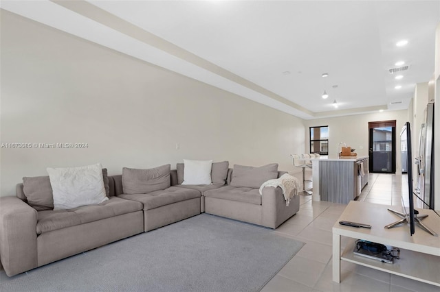 living room with light tile patterned flooring