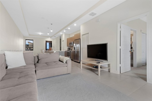 living room featuring light carpet