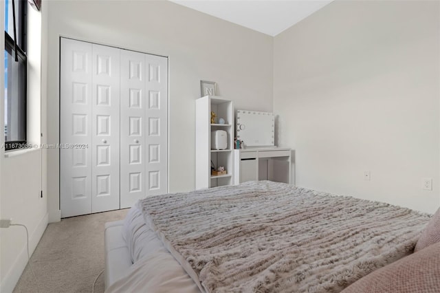 carpeted bedroom featuring a closet