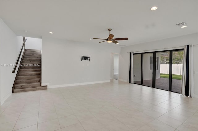 spare room with light tile patterned floors and ceiling fan