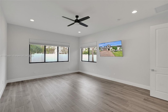 empty room featuring light hardwood / wood-style flooring and ceiling fan