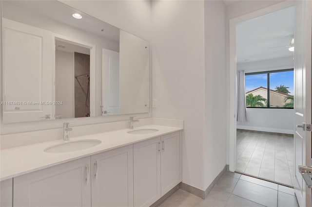 bathroom with vanity, a shower, tile patterned floors, and ceiling fan