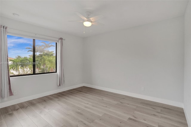 unfurnished room with ceiling fan and light hardwood / wood-style flooring