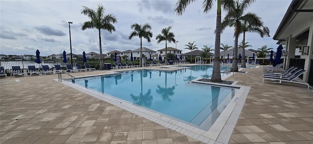 view of swimming pool featuring a patio