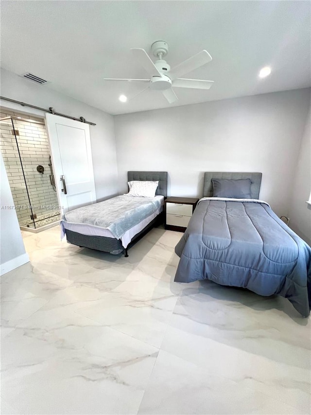 bedroom with a barn door and ceiling fan