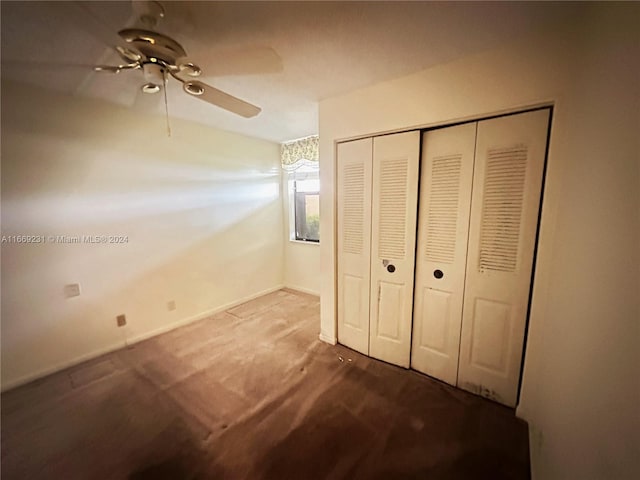 unfurnished bedroom with carpet floors, a closet, and ceiling fan