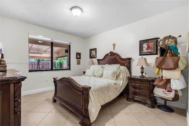 bedroom with light tile patterned floors