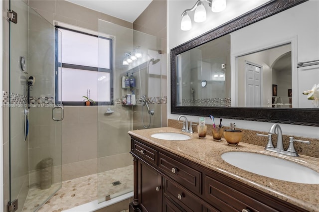 bathroom with vanity and an enclosed shower