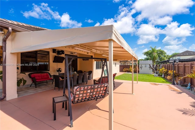 view of patio / terrace featuring a storage unit