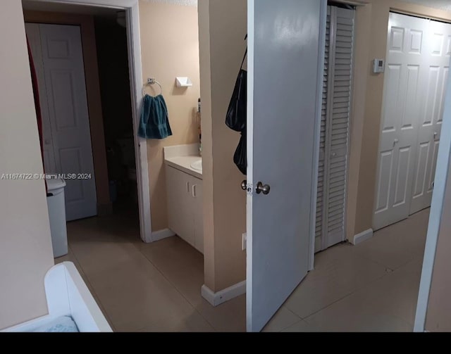 bathroom featuring tile patterned floors and vanity