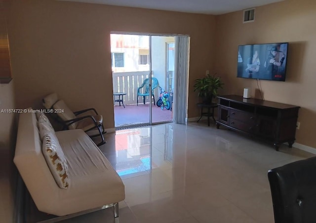 living room with light tile patterned floors