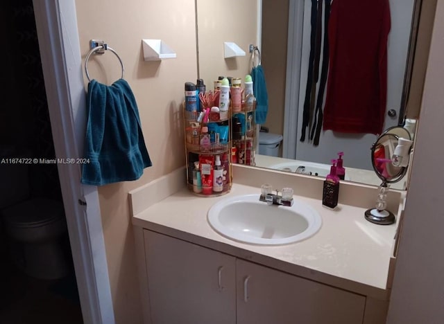 bathroom with vanity and toilet