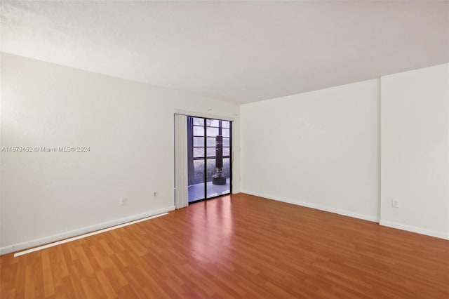 empty room featuring hardwood / wood-style floors