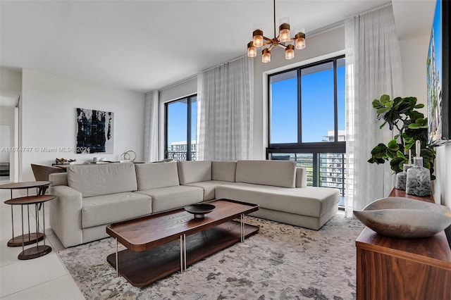 living room featuring a notable chandelier and tile patterned floors