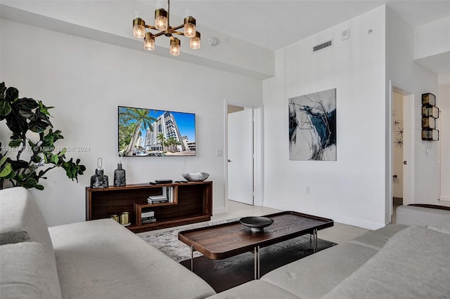 living room featuring a notable chandelier