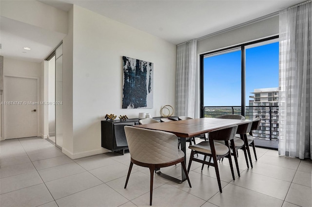 dining area with light tile patterned floors