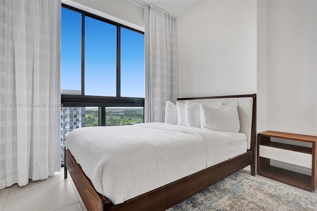 bedroom with light tile patterned flooring