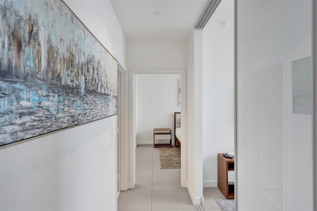 hallway featuring light tile patterned floors