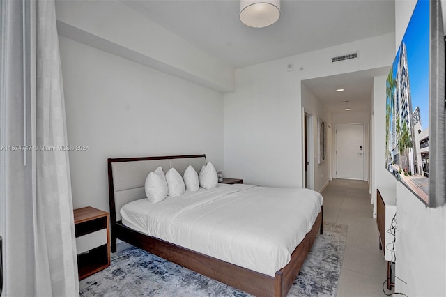 bedroom with tile patterned floors