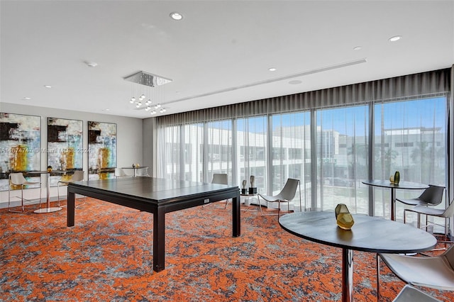 recreation room featuring a notable chandelier