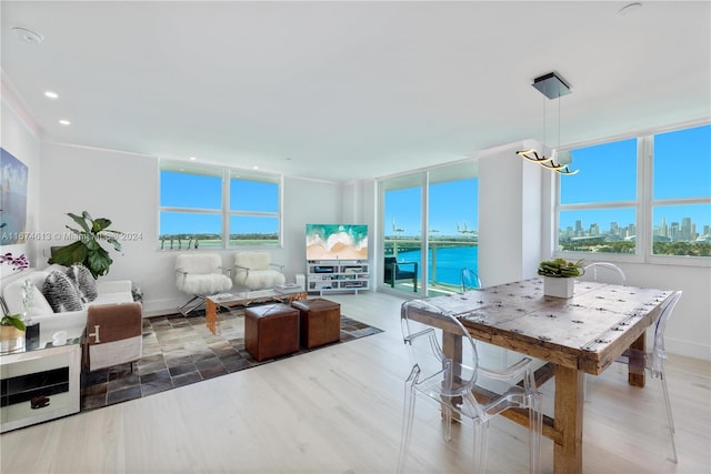 650 W Ave Unit 1101, Miami Beach, FL 33139 - living room featuring plenty of natural light, wood finished floors, a chandelier, recessed lighting, and a view of skyline