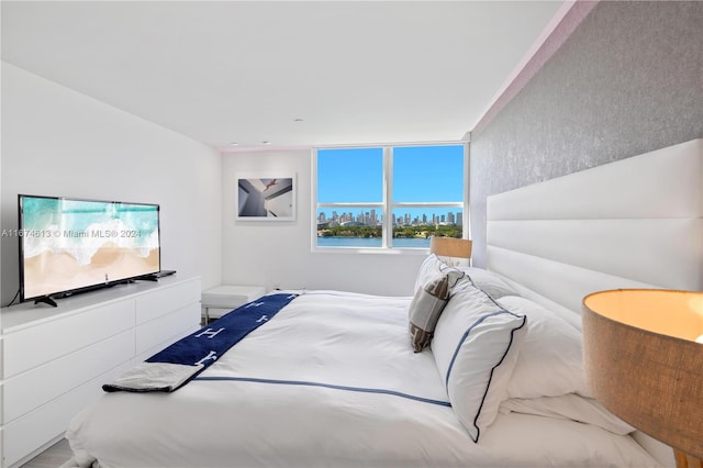 bedroom featuring a water view