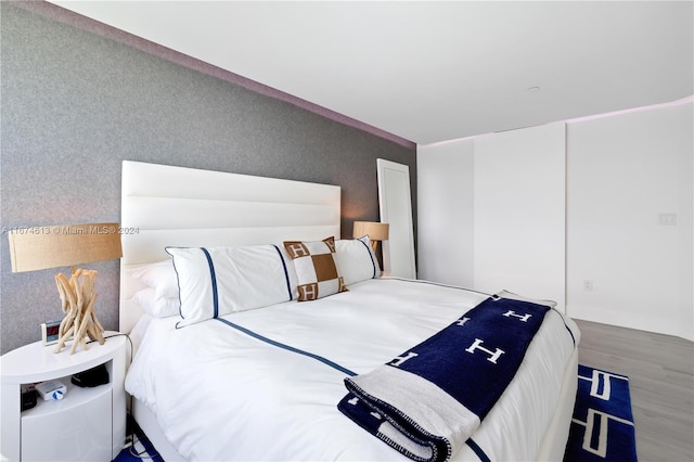 bedroom featuring hardwood / wood-style floors