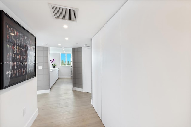 650 W Ave Unit 1101, Miami Beach, FL 33139 - hallway with light wood-style flooring and recessed lighting