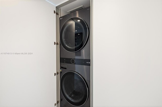 laundry room featuring stacked washing maching and dryer