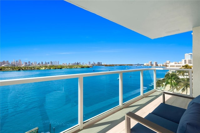 balcony featuring a water view