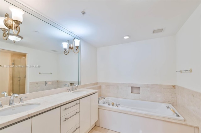 full bathroom with double vanity, visible vents, a sink, and a bath